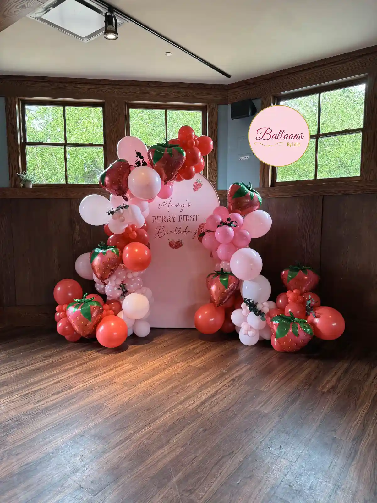 first birthday balloon setup with neutral colors
