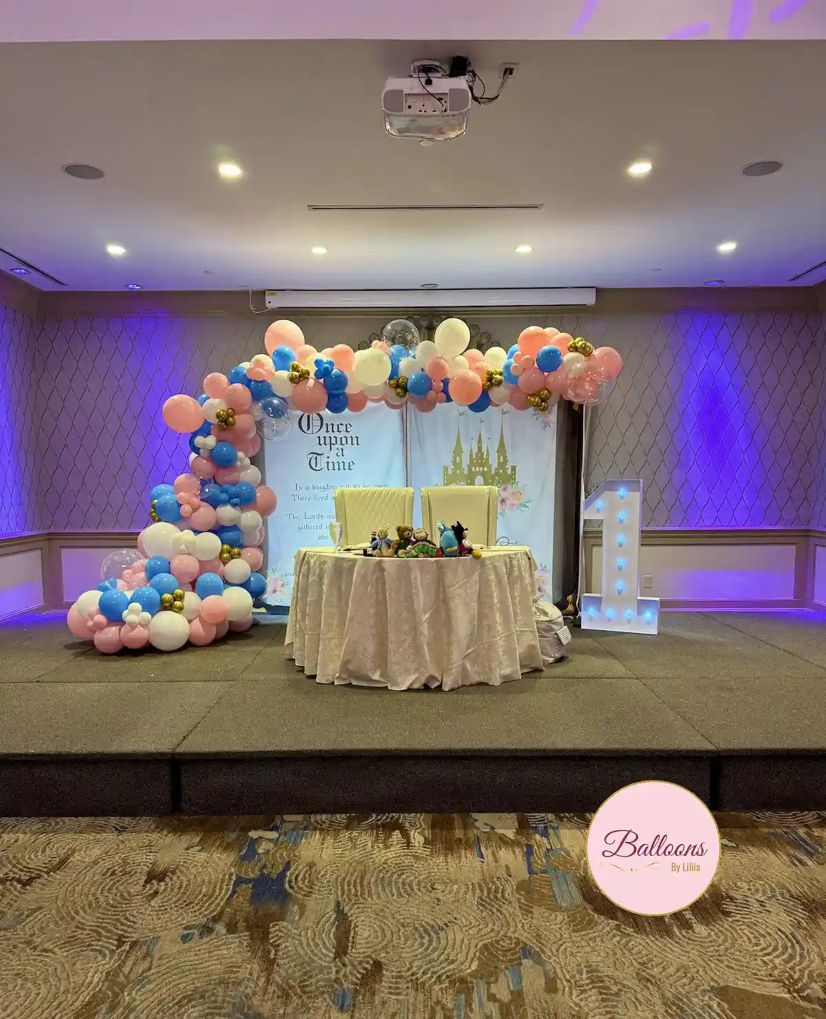 first birthday balloon setup with neutral colors